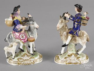 Pair of Derby porcelain figural groups, 19th c., of a man and woman riding goats, 5 3/4'' h.