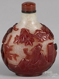 Chinese red and snowflake glass snuff bottle with figural decoration, 2 3/4'' h.