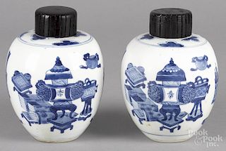 Pair of Chinese blue and white porcelain ginger jars, 19th c., decorated with scholarly objects