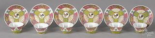 Chinese Yongzheng period set of six famille rose cups and saucers with rooster decoration