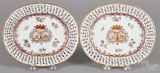 Pair of Chinese export porcelain armorial undertrays, late 18th c., with reticulated borders, 7'' l.
