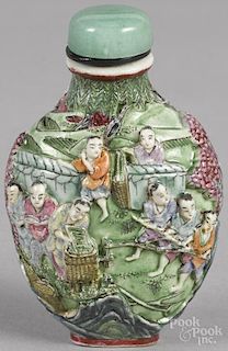Chinese porcelain snuff bottle with relief figural decoration, 3 1/4'' h.