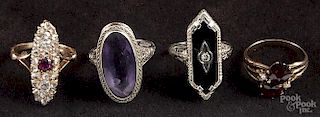 Four precious stone rings, to include a yellow gold, garnet, and pearl ring