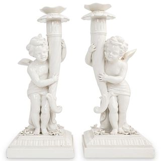Pair of White Porcelain Cherub Candle Holders