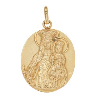 Medalla en oro amarillo de 18k. Imagen de Virgen con niño. Peso: 4.9 g.