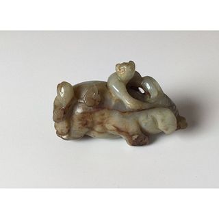 A Chinese Carved Jade Figure of Little Child on Elephant's Back