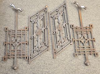 Two Pairs of Architectural Brackets or Panels, iron or metal, heights 27 and 36 inches.