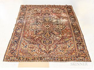 Heriz Carpet, Iran, c. 1940, (worn), 11 ft. 7 in. x 9 ft.