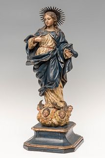 Virgin; Andalusian school, second half of the 18th century.
Carved, gilded and polychrome wood, with glass eyes.