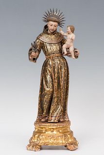 Spanish-Philippine School; ca. 1700.
"Saint Anthony of Padua with Child".
Carved wood, gilded and polychrome. Silver potencies.
Presents faults in the