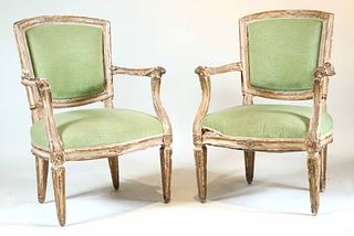 Pair of Neoclassical Parcel-Gilt Open Armchairs