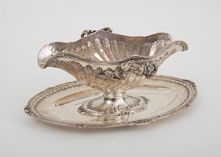 FRENCH SILVER DOUBLE SPOUTED SAUCE BOAT AND ATTACHED STAND, IN THE LOUIS XV STYLE