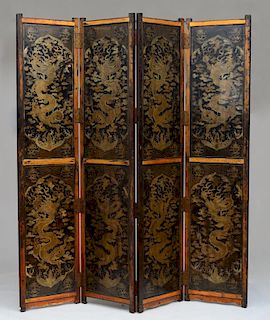CHINESE BLACK LACQUER AND PARCEL-GILT FOUR-PANEL SCREEN