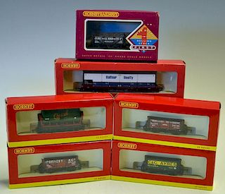 Selection of Hornby 00 Gauge Rolling Stock including Frost plank wagon R6488, Monmouth Steam Saw Mil