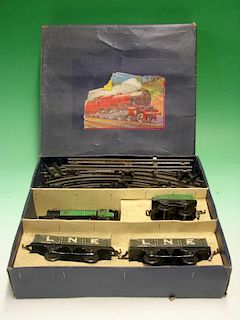 Hornby 0 Gauge M1 goods train set with locomotive, tender, two trucks and track layout. Boxed, with