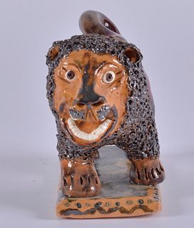 Billy Ray Hussey Lion on stand