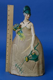 Cast Iron Painted Doorstop of a Lady with Flower Bouquet