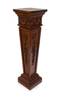 Neoclassical pedestal, late 19th century. 
Carved wood.