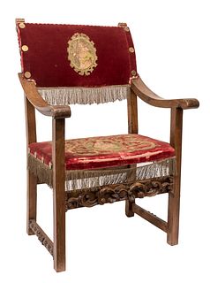 Frailero armchair; Spain, 17th century. 
Carved walnut. 
Later upholstery with embroidered elements from the 17th century on velvet from the 20th cent