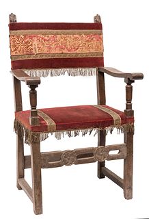 Frailero armchair; Spain, 17th century. 
Carved walnut. 
Later upholstery with embroidered elements from the 17th century on velvet from the 20th cent