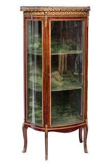Showcase; Louis XVI style, 19th century. 
Beech wood imitating mahogany, brass, and gilt bronze with marble top. 
It has a key.