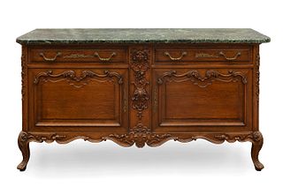 English Provençal Louis XV style credenza, mid 20th century. 
Carved oak wood, bronze and marble.