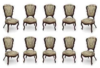 Set of ten Elizabethan chairs, ca. 1850. 
In carved mahogany and silk upholstery.