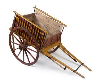 Dog pulling cart from the 19th century. 
Painted wood with iron fittings and wheel rings.