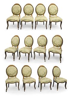 Set of twelve Elizabethan chairs inspired by Louis XVI. Spain, ca. 1850. Stuccoed, gilded and ebonized wood.
