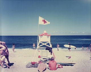JOEL MEYEROWITZ (American b. 1938) A PHOTOGRAPH, "Lifeguard - Ballstry Beach, Truro," CAPE COD, MASSACHUSETTS, 1976,