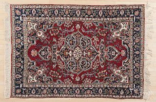 Three semi-antique Persian throw rugs, 5'9'' x 4', 5' x 3'5'', and 5' x 3'3''.