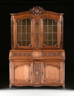 A LARGE LOUIS XV STYLE CARVED OAK BUREAU BIBLIOTHÃˆQUE, LATE 19TH/EARLY 20TH CENTURY, 