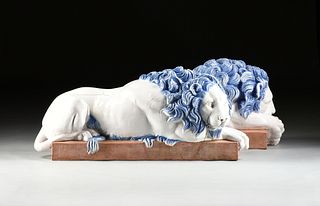 after ANTONIO CANOVA (Italian 1757-1822) A PAIR OF GLAZED TERRACOTTA LIONS, ITALIAN, 20TH CENTURY,