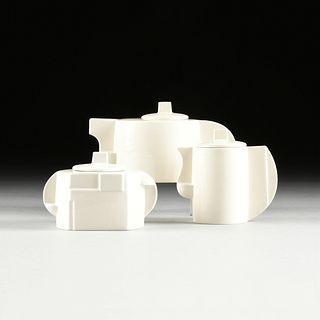 TWO RUSSIAN SUPREMATIST STYLE WHITE PORCELAIN THREE PIECE TEA SERVICES, AFTER KAZIMIR S. MALEVICH, CIRCA 1990s,
