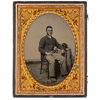 [CIVIL WAR]. Quarter plate ambrotype of Union infantry private seated in a studio. N.p.: n.p., [ca 1861-1862].
