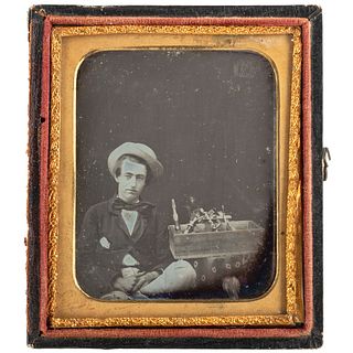 [EARLY PHOTOGRAPHY]. Sixth plate occupational daguerreotype of young man with tool chest. N.p.: n.p., n.d.