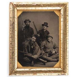 [EARLY PHOTOGRAPHY]. Quarter plate tintype of four armed outdoorsmen. N.p.: n.p., [ca 1880s].