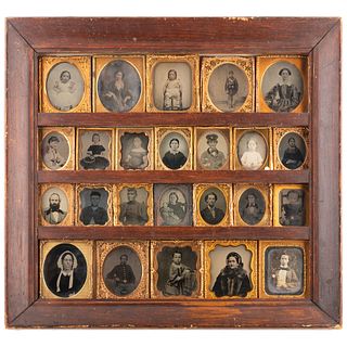 [EARLY PHOTOGRAPHY]. Daguerreian wall frame containing 24 daguerreotypes, ambrotypes, and tintypes, incl. Civil War soldiers and African American woma