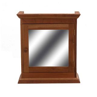 Botiquín. SXX. Talla en madera. Con puerta abatible con espejo de luna rectangular, entrepaño interno. 70 x 62 x 21 cm