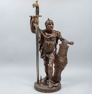 ANÓNIMO. Siglo XX. Soldado grecorromano. Con espada adaptada. Fundición en metal patinado. 78 cm