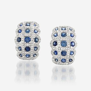 A pair of sapphire, diamond, and eighteen karat white gold earrings