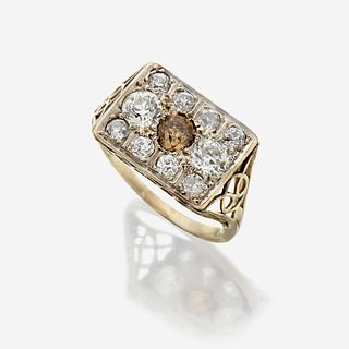 A colored diamond, diamond, and fourteen karat white gold ring