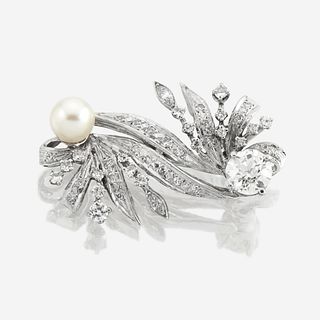 A fourteen karat white gold, diamond, and cultured pearl brooch