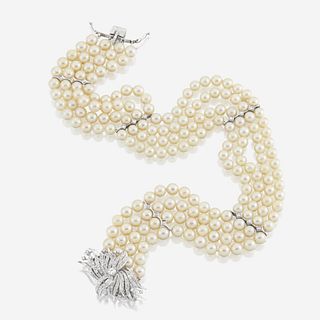 A cultured pearl, diamond, and ten karat white gold choker