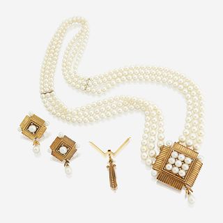 A cultured pearl, eighteen karat gold, and diamond necklace with matching earrings