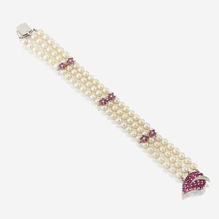 A cultured pearl, ruby, diamond, and fourteen karat white gold bracelet