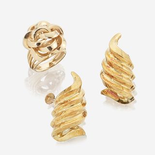 A pair of eighteen karat gold ear clips and a fourteen karat gold ring