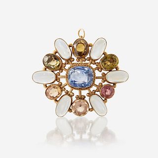 A fourteen karat gold and gem-set pendant/brooch