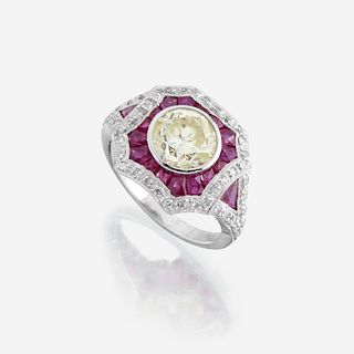 A colored diamond, diamond, ruby, and platinum ring