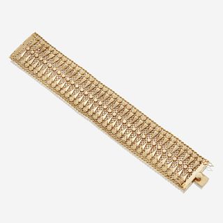 An eighteen karat gold wide bracelet